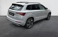Miniature SKODA KAROQ 2.0 TDI 150 ch SCR DSG7 4x4 Sportline extérieur trois quart arrière droit 4648
