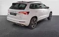 Miniature SKODA KAROQ 2.0 TDI 150 ch SCR DSG7 4x4 Sportline extérieur trois quart arrière droit 2130110